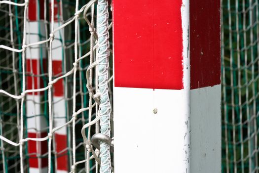 detail of a handball goal with red and white stripes