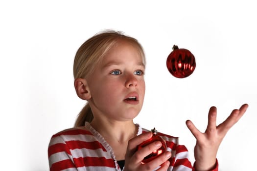 portait of a cute scandinavian girl in studio, juggling