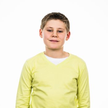 portrait of young boy with yello sweetshirt