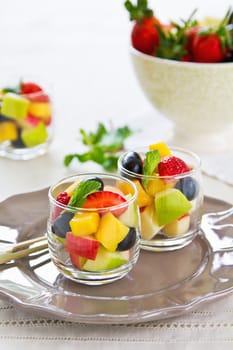 Varieties of fruits salad in small glasses
