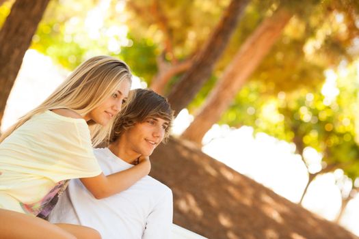 young beautiful couple enjoying a day on the park on summer