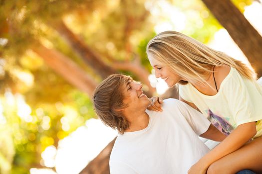 young beautiful couple enjoying a day on the park on summer