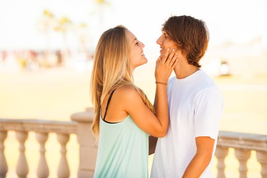 young beautiful couple enjoying a day on the park on sunny day