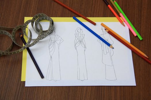 the collection of fashion drawings on clothes with colored pencils