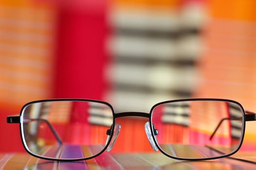 Pair of glasses tanding on a table