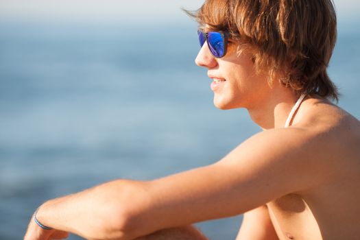 young healthy beautiful men portrait laughing on the beach