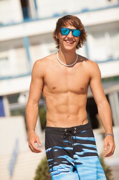 young healthy beautiful men portrait laughing on the beach