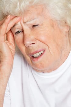 Senior woman suffering from headache