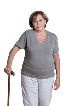 Portrait of mature woman with walking stick.