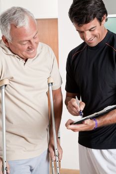Patient on crutches discusses his progress.