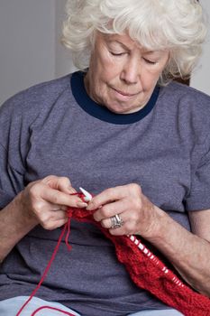 Portrait of a senior woman knitting.