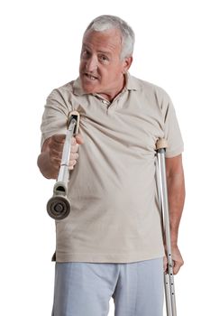 Senior Man Holding Crutch Like a Weapon .