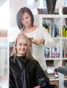 Young woman at the hairdresser salon .