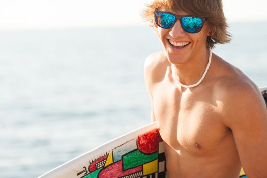 young surfer about to get into the sea