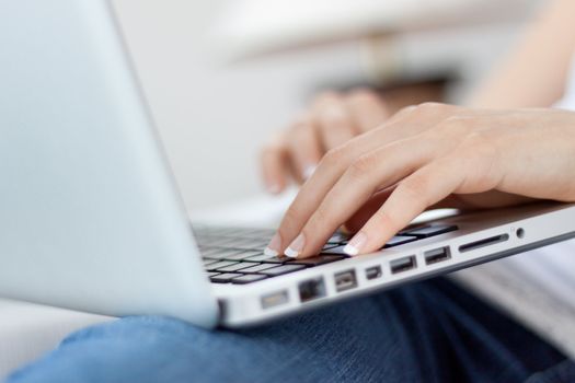 lifestyle hands close up on laptop keyboard