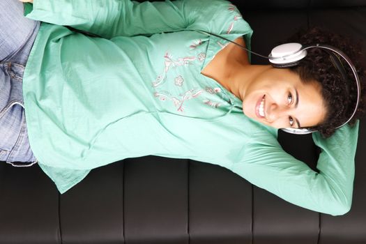 A jung brazilian woman relaxing on the sofa.