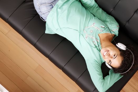 A jung brazilian woman relaxing on the sofa.