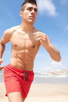 young handsome man jogging outdoors