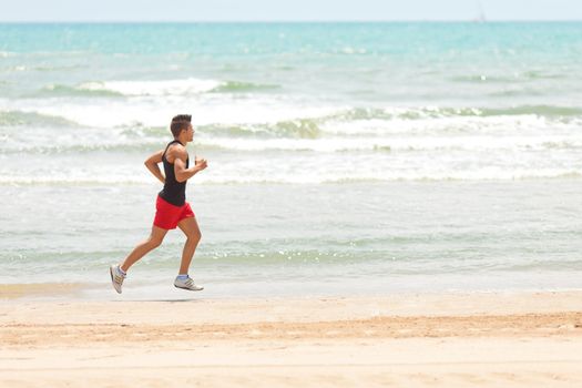 young handsome man jogging outdoors