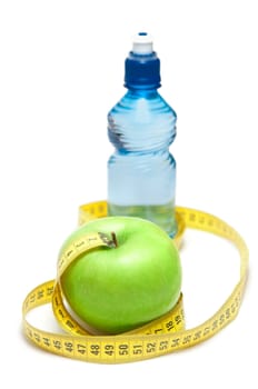 Green apple and bottle with water