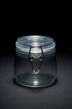 Empty glass jar with closed cap