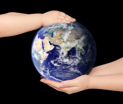 Child and woman holds earth globe on black