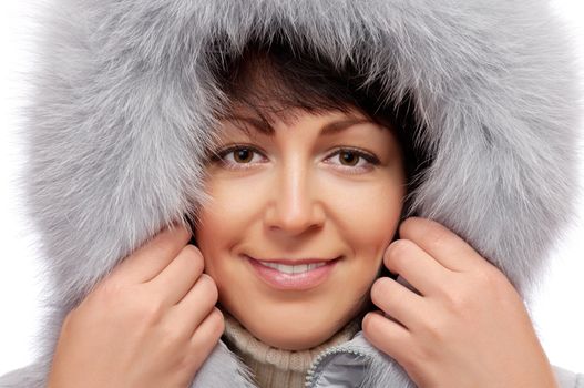 Closeup portrait of young woman in fluffy hood