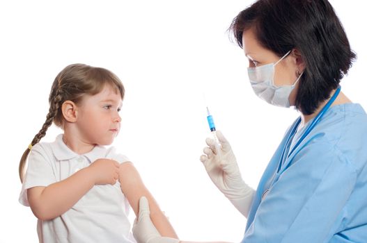 doctor does an inoculation to little girl