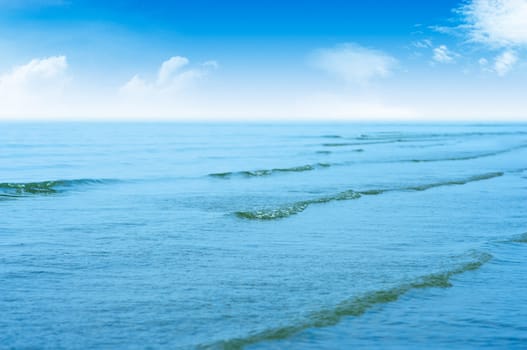 Sea waves and cloudy skies