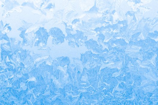 Light blue frozen window glass background