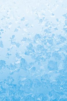 Light blue frozen window glass background