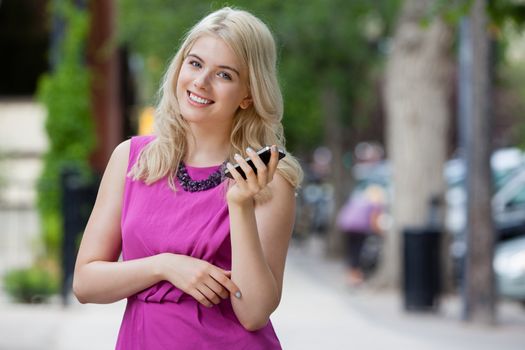 Portrait of an attractive young woman talking on mobile phone