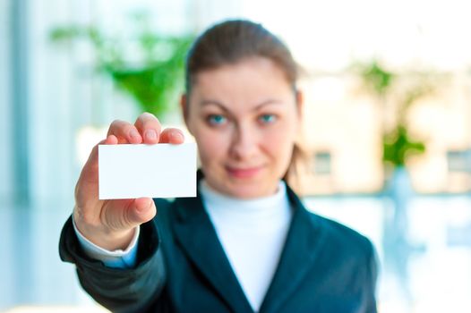 The girl shows a blank business card manager