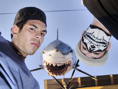 Two rappers with a model shark