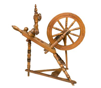 Antique spinning wheel against white background