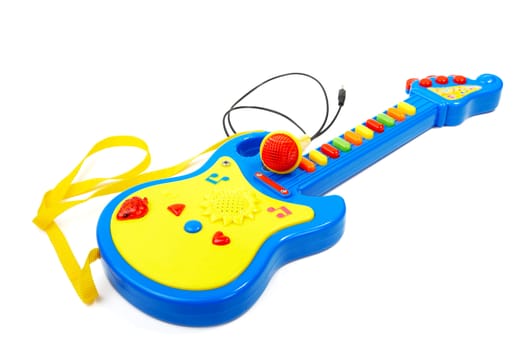 Children's toy  guitar with  microphone isolated on a white background