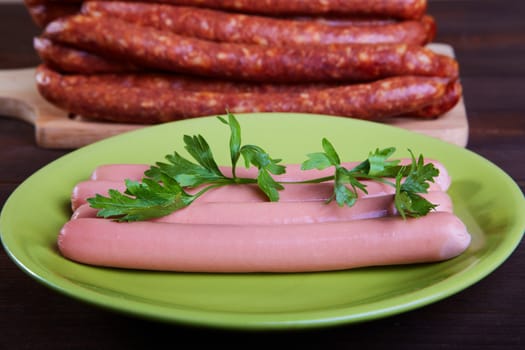 Sausage and sausages on an old wooden table