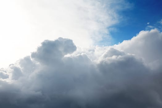 Cumulus clouds and the dark blue sky