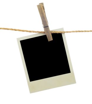 Three blank instant photos hanging on the clothesline. Isolated on white background.