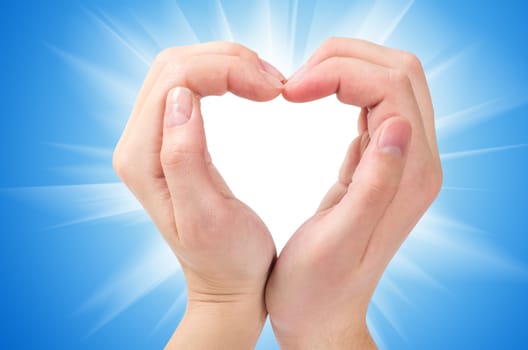 Two hands form a heart shape with their fingers