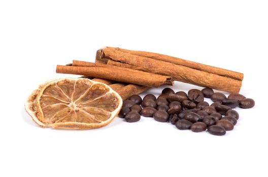 cinnamon, lemon and coffee beans isolated on white