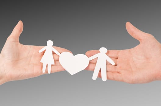 Cutout paper chain family with the protection of cupped hands, concept for security and care