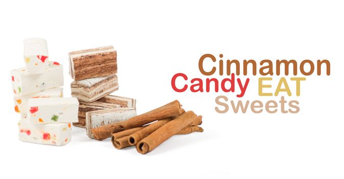 Sweets and cinnamon sticks isolated on white background