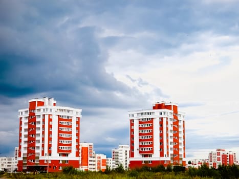 Buildings In A City In An Environment Of Green Trees