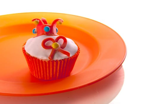 a cupcake on an orange plate ( celebrating the dutch coronation )