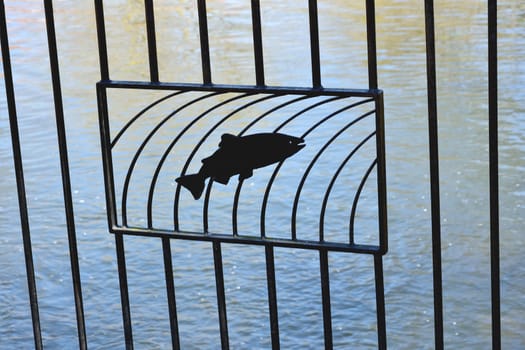 fish sillhouette on railings