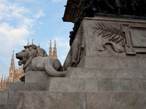 Lion statue of Vittorio Emanuele II monument in Piazza del Duomo Milan, Italy
