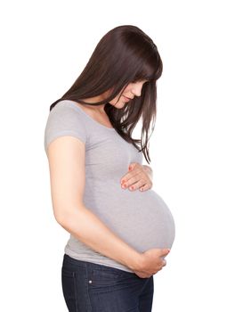 Portrait of a happy pregnant woman in third trimester isolated over white