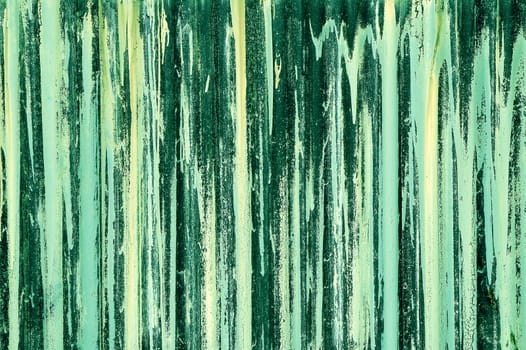 green streak abstract on corrugated iron barricade