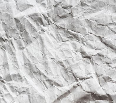 Crumpled white sheet. Paper background